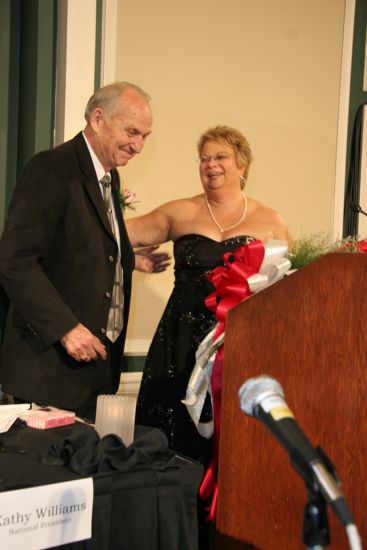 Kathy Williams Receiving Flowers at Convention Carnation Banquet Photograph 3, July 15, 2006 (image)