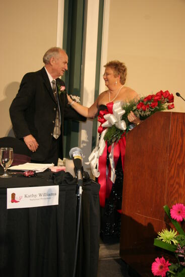 Kathy Williams Receiving Flowers at Convention Carnation Banquet Photograph 2, July 15, 2006 (image)