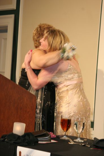 Kathy Williams Hugging Robin Fanning at Convention Carnation Banquet Photograph, July 15, 2006 (image)