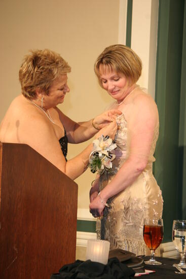 Kathy Williams Pinning Robin Fanning at Convention Carnation Banquet Photograph 1, July 15, 2006 (image)