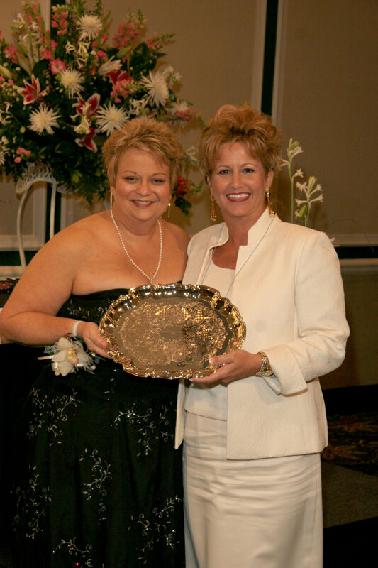 Kathy Williams and Unidentified With Award at Convention Carnation Banquet Photograph 8, July 15, 2006 (Image)
