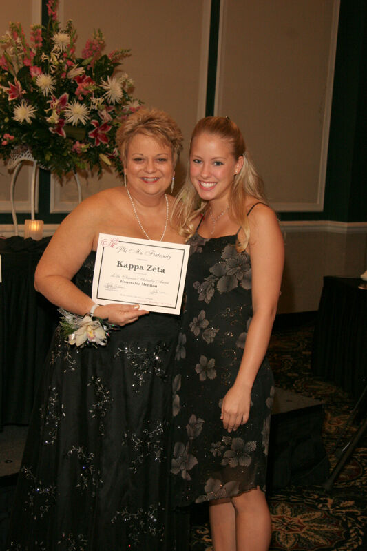 Kathy Williams and Kappa Zeta Chapter Member With Certificate at Convention Carnation Banquet Photograph, July 15, 2006 (Image)