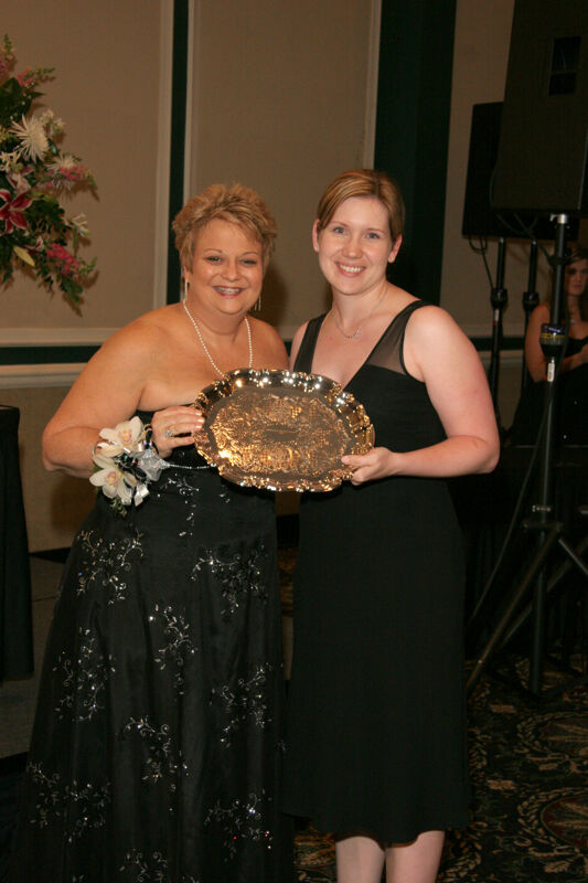 Kathy Williams and Unidentified With Award at Convention Carnation Banquet Photograph 7, July 15, 2006 (Image)