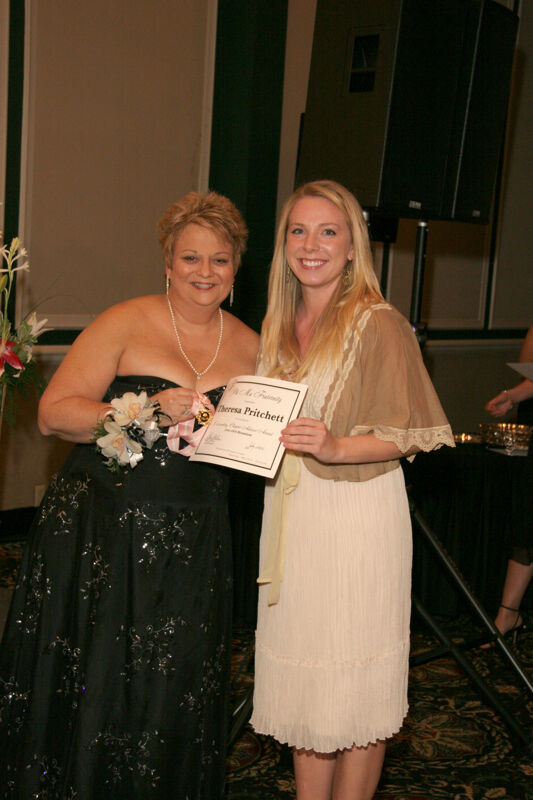 Kathy Williams and Theresa Pritchett With Certificate at Convention Carnation Banquet Photograph, July 15, 2006 (Image)