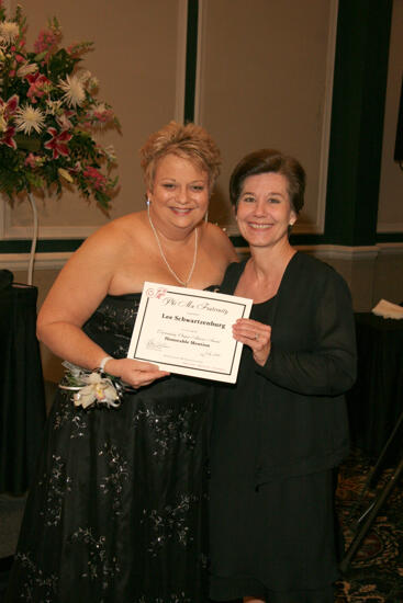 Kathy Williams and Lee Schwartzenburg With Certificate at Convention Carnation Banquet Photograph, July 15, 2006 (image)