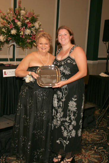 Kathy Williams and Unidentified With Award at Convention Carnation Banquet Photograph 15, July 15, 2006 (image)