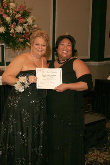 Kathy Williams and Winter Park Alumna With Certificate at Convention Carnation Banquet Photograph, July 15, 2006 (image)