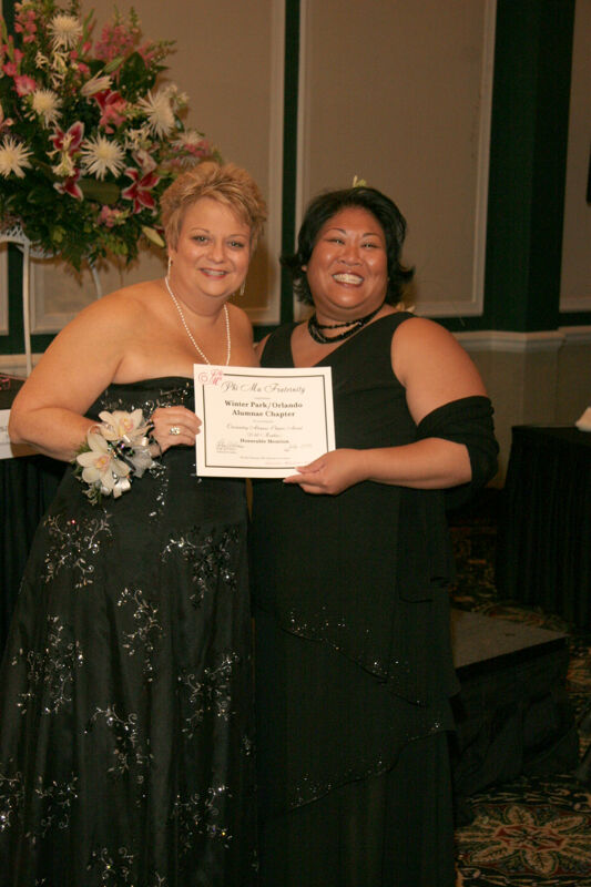 Kathy Williams and Winter Park Alumna With Certificate at Convention Carnation Banquet Photograph, July 15, 2006 (Image)