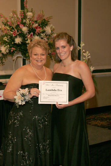 Kathy Williams and Lambda Eta Chapter Member With Certificate at Convention Carnation Banquet Photograph, July 15, 2006 (image)