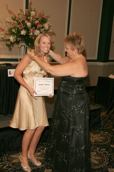 Kathy Williams Presenting Medal to Amber Aiken at Convention Carnation Banquet Photograph, July 15, 2006 (image)