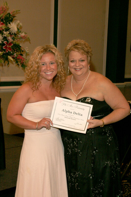 Kathy Williams and Alpha Delta Chapter Member With Certificate at Convention Carnation Banquet Photograph, July 15, 2006 (Image)