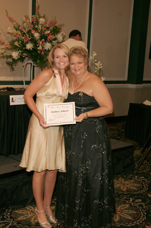 Kathy Williams and Amber Aiken With Award at Convention Carnation Banquet Photograph, July 15, 2006 (Image)