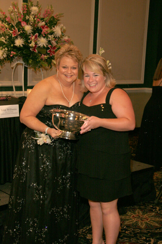 Kathy Williams and Unidentified With Award at Convention Carnation Banquet Photograph 2, July 15, 2006 (Image)