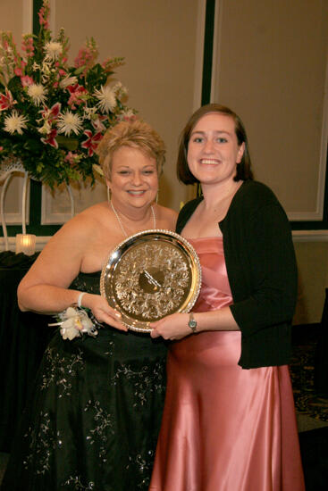 Kathy Williams and Unidentified With Award at Convention Carnation Banquet Photograph 5, July 15, 2006 (image)