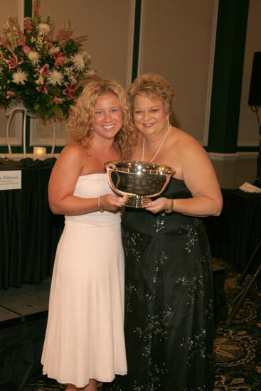 Kathy Williams and Unidentified With Award at Convention Carnation Banquet Photograph 14, July 15, 2006 (image)