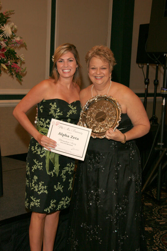 Kathy Williams and Alpha Zeta Chapter Member With Award at Convention Carnation Banquet Photograph, July 15, 2006 (Image)