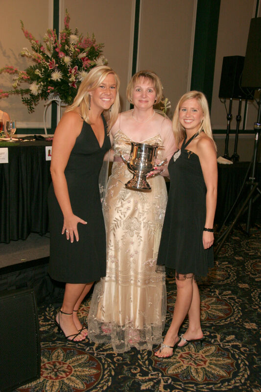 Robin Fanning and Two Phi Mus With Award at Convention Carnation Banquet Photograph, July 15, 2006 (Image)