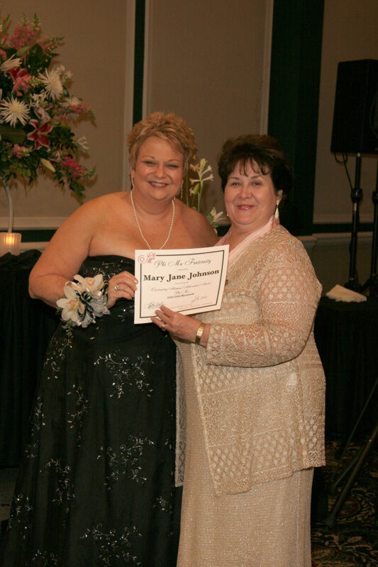 Kathy Williams and Mary Jane Johnson With Award at Convention Carnation Banquet Photograph, July 15, 2006 (Image)