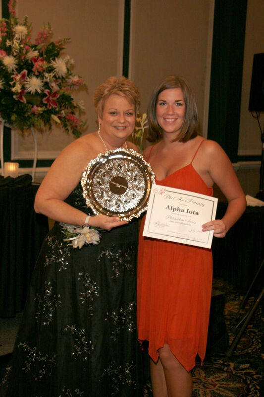 Kathy Williams and Alpha Iota Chapter Member With Award at Convention Carnation Banquet Photograph, July 15, 2006 (Image)