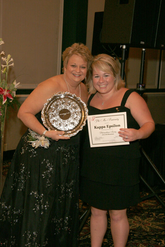 Kathy Williams and Kappa Epsilon Chapter Member With Award at Convention Carnation Banquet Photograph, July 15, 2006 (Image)