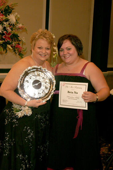 Kathy Williams and Beta Nu Chapter Member With Award at Convention Carnation Banquet Photograph, July 15, 2006 (image)