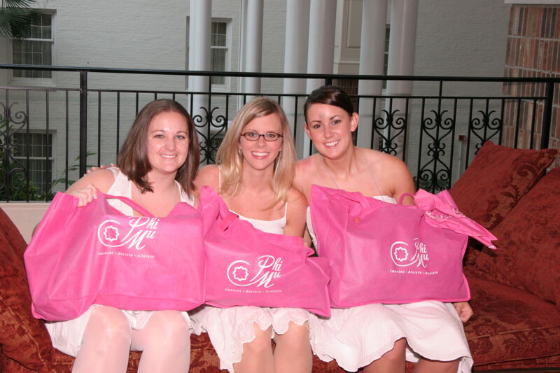 Three Phi Mus With Pink Bags Before Saturday Convention Session Photograph, July 15, 2006 (Image)
