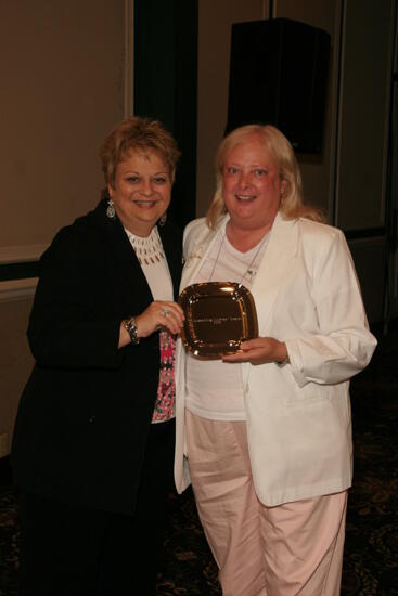 Kathy Williams and Unidentified With Award at Convention Sisterhood Luncheon Photograph 1, July 15, 2006 (image)