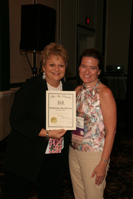 Kathy Williams and Kim MacMullan With Certificate at Convention Sisterhood Luncheon Photograph, July 15, 2006 (Image)