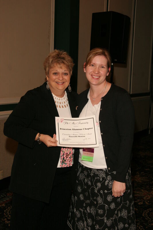 July 15 Kathy Williams and Princeton Alumna With Certificate at Convention Sisterhood Luncheon Photograph 1 Image