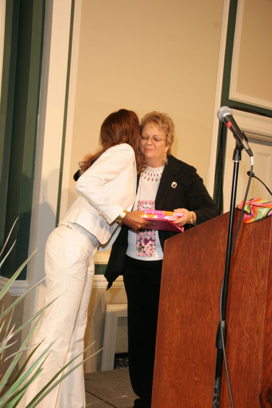 Rikki Marver Receiving Gift from Kathy Williams at Convention Sisterhood Luncheon Photograph, July 15, 2006 (Image)
