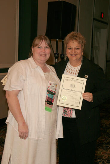 Kathy Williams and Pam Backstrom With Certificate at Convention Sisterhood Luncheon Photograph, July 15, 2006 (image)