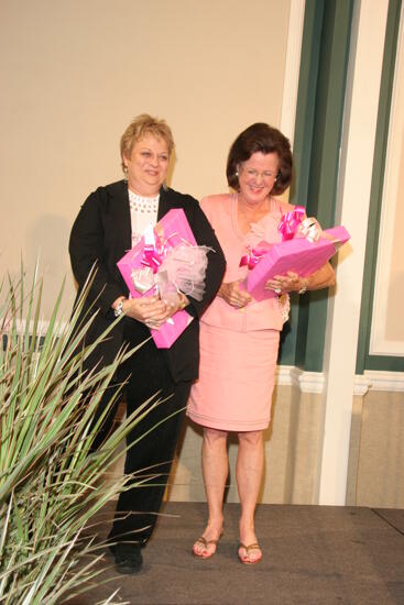 Shellye McCarty and Kathy Williams With Gifts at Convention Sisterhood Luncheon Photograph 1, July 15, 2006 (image)