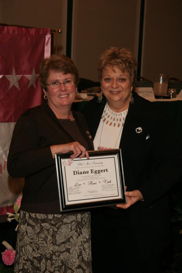 Kathy Williams and Diane Eggert With Plaque at Convention Sisterhood Luncheon Photograph 1, July 15, 2006 (image)