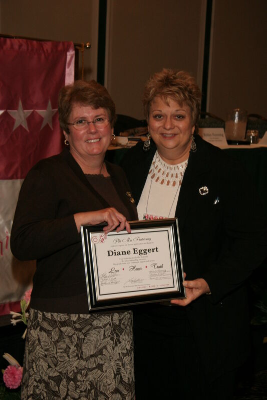 Kathy Williams and Diane Eggert With Plaque at Convention Sisterhood Luncheon Photograph 1, July 15, 2006 (Image)