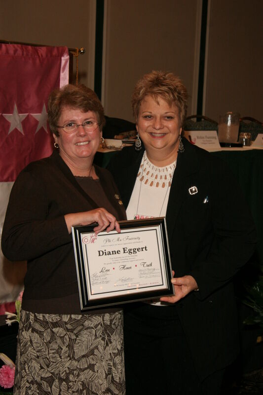 Kathy Williams and Diane Eggert With Plaque at Convention Sisterhood Luncheon Photograph 2, July 15, 2006 (Image)