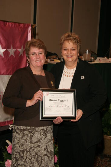 Kathy Williams and Diane Eggert With Plaque at Convention Sisterhood Luncheon Photograph 3, July 15, 2006 (image)