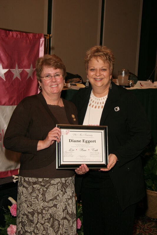 Kathy Williams and Diane Eggert With Plaque at Convention Sisterhood Luncheon Photograph 3, July 15, 2006 (Image)