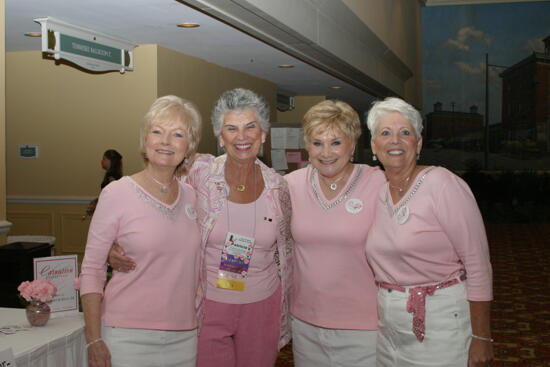 Patricia Sackinger and Three Unidentified Phi Mus at Convention Registration Photograph 2, July 2006 (image)