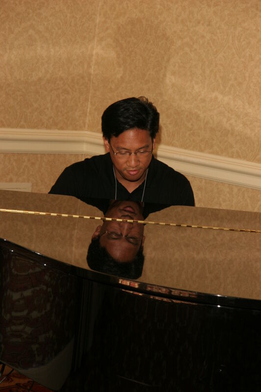 July 13 Victor Carreon Playing Piano at Convention Photograph 2 Image