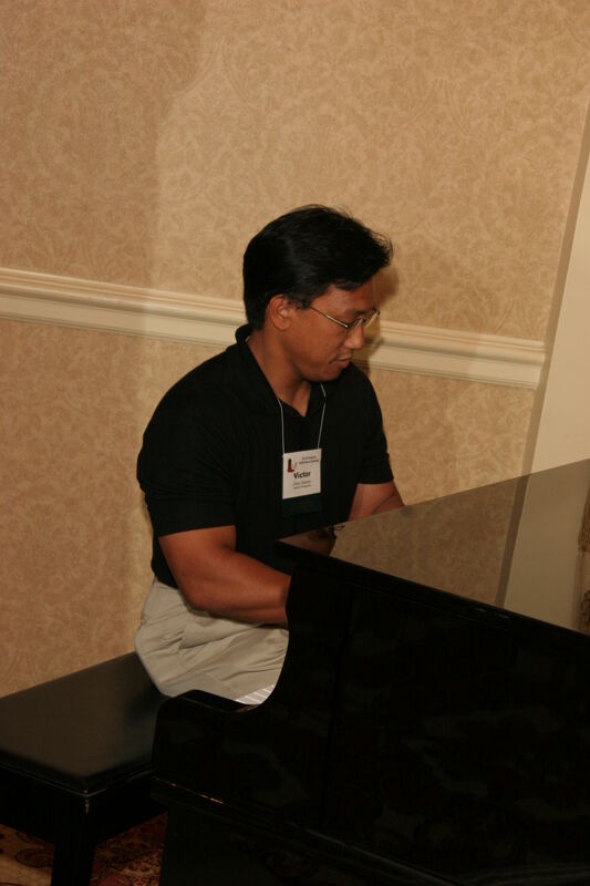 Victor Carreon Playing Piano at Convention Photograph 8, July 13, 2006 (Image)