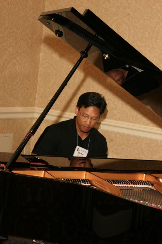 Victor Carreon Playing Piano at Convention Photograph 11, July 13, 2006 (Image)