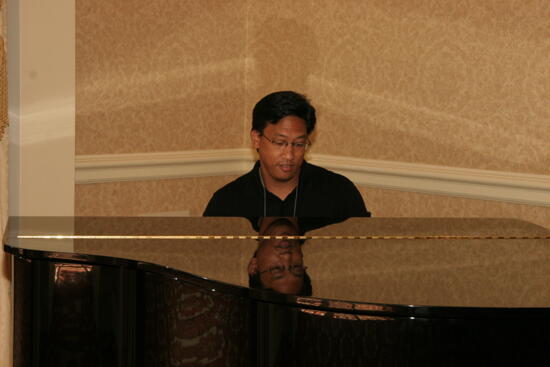 Victor Carreon Playing Piano at Convention Photograph 4, July 13, 2006 (image)