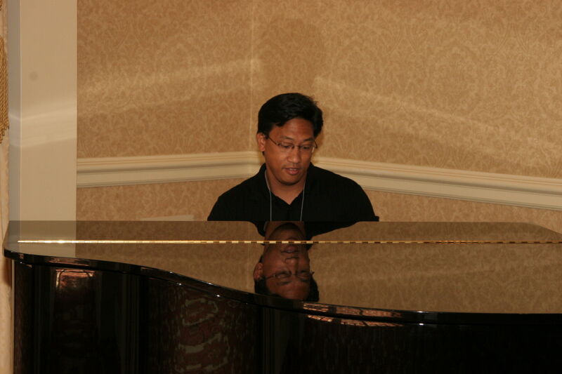 Victor Carreon Playing Piano at Convention Photograph 4, July 13, 2006 (Image)