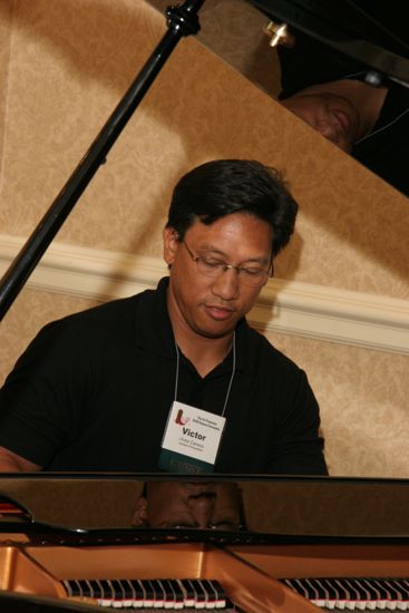 Victor Carreon Playing Piano at Convention Photograph 16, July 13, 2006 (image)