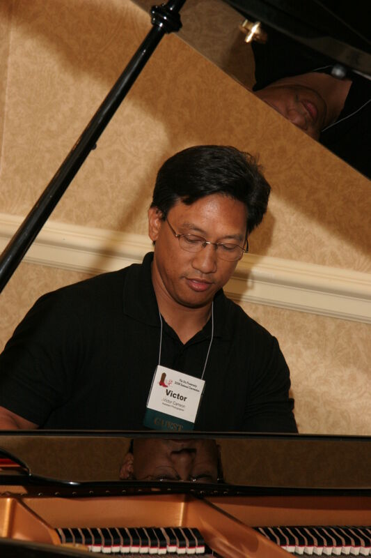 Victor Carreon Playing Piano at Convention Photograph 16, July 13, 2006 (Image)