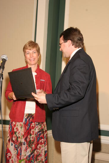 Therese DeMouy and Unidentified Man With Award at Thursday Convention Luncheon Photograph 2, July 2006 (image)