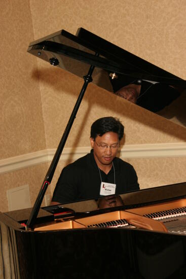 Victor Carreon Playing Piano at Convention Photograph 10, July 13, 2006 (image)