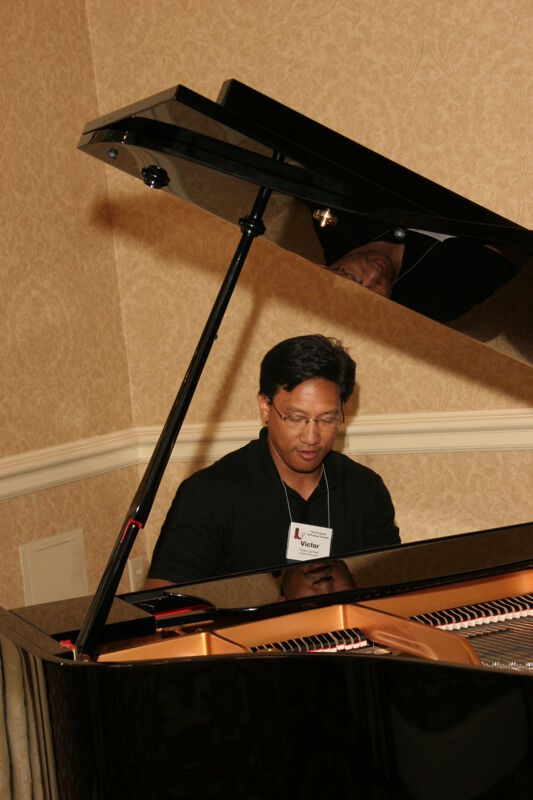 Victor Carreon Playing Piano at Convention Photograph 10, July 13, 2006 (Image)