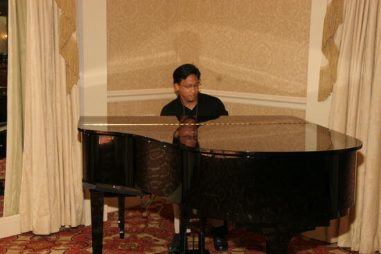 Victor Carreon Playing Piano at Convention Photograph 3, July 13, 2006 (image)