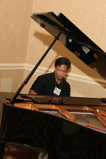 Victor Carreon Playing Piano at Convention Photograph 15, July 13, 2006 (image)